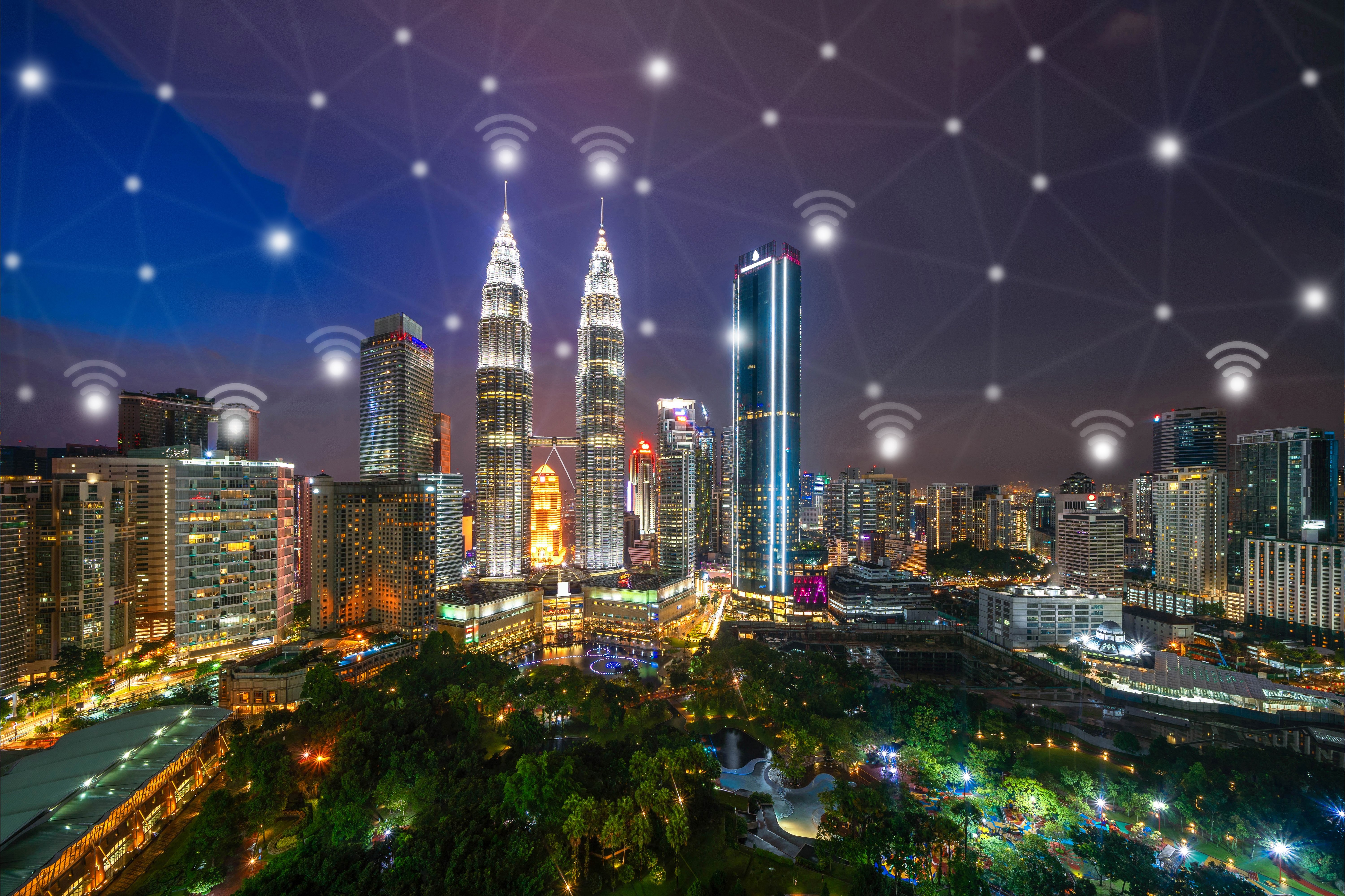 digital-network-connection-lines-and-wifi-icons-with-kuala-lumpur-downtown-malaysia-financial_t20_E4E0LX